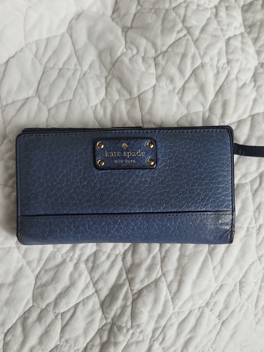 kate spade navy pebbled leather wristlet wallet with gold plaque